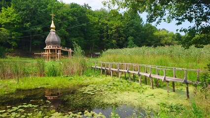 Sticker - The overgrown Khorol River with stilt bridge, Cherevky, Ukraine