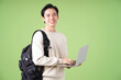 Image of young Asian student on background