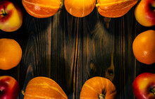 Pumpkins And Apples On A Wooden Background With A Place To Copy.