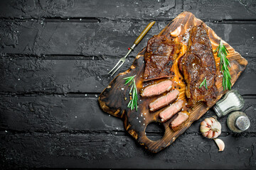 Wall Mural - Grilled beef steak with rosemary and spices.