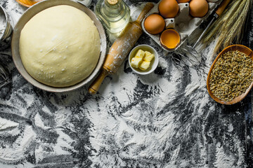 Sticker - Dough with eggs, butter and grain in bowls.