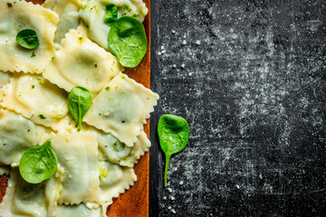 Poster - Ravioli with greens on a plate.