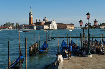 Wall Mural - View of San Giorgio Maggiore from the landing stage for Gondolas in front of the Palazzo Ducale in Venice, Italy