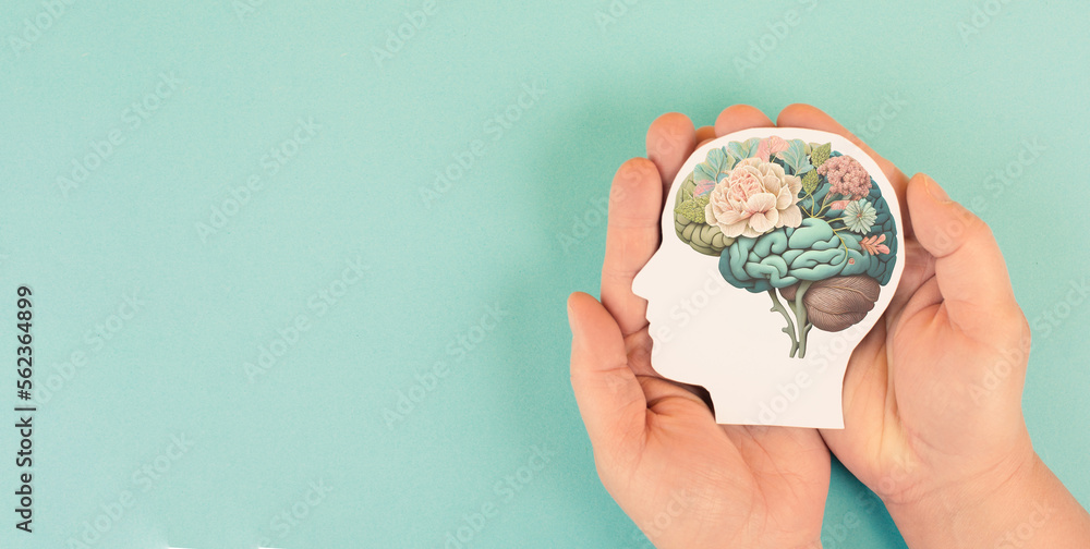 Hands holding paper head, human brain with flowers, self care and ...