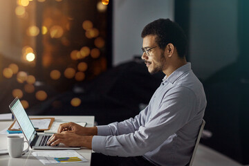 Aufkleber - Businessman, laptop and typing with smile for research, analysis or web design on desk at the office. Employee man sitting and working on computer late at night in dedication to meet project deadline