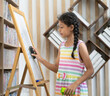 © Nassorn - Young girl student standing in classroom erasing text on a whiteboard. Portrait of pretty Asian schoolgirl kid holding board eraser cleaning whiteboard. Child education lifestyle in elementary school.
