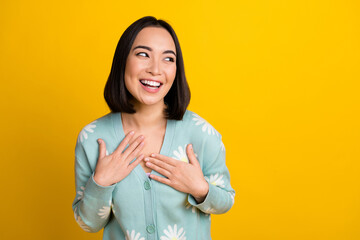 Poster - Photo of funny overjoyed satisfied chinese woman touch chest laughing have fun look mockup new tv show promotion isolated on yellow color background