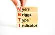 MBTI Myers Briggs type indicator symbol. Concept words MBTI Myers Briggs type indicator on block on beautiful white background. Psychological MBTI Myers Briggs type indicator concept. Copy space