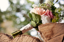 Close-up Of Bouquet On Wood At Wedding Ceremony
