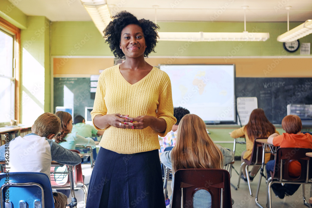 Portrait, teacher and black woman with students learning in classroom ...