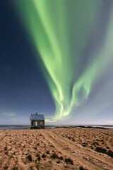 auroraborealis above an abandoned farm house - iceland - winter