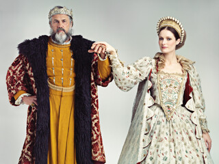 Love, victorian and couple with king and queen for renaissance, royalty and vintage in England. Vintage, luxury and fantasy with portrait of man and woman for elegant, medieval and monarch in studio