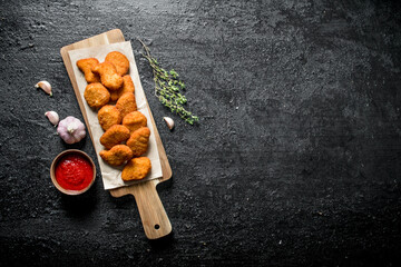 Poster - Chicken nuggets with thyme , garlic and sauce in bowl.