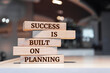 Wooden blocks with words 'Success is Built on Planning'. Business concept