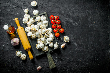 Sticker - Raw dumpling with meat, cherry tomatoes and garlic.