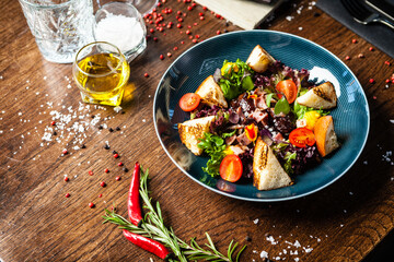 Wall Mural - Warm chicken liver salad with port wine-honey sauce. Carrot cream, bacon, cherry tomatoes, brioche. Delicious healthy traditional food closeup served for lunch in modern gourmet cuisine restaurant