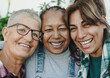 © Sabrina - Happy multiracial senior women having fun together outdoor - Elderly generation people hugging each other