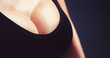 © Yevhen - Woman, huge breasts, big boobs. Plastic surgery. Woman with big natural sexy boobs in lingerie. Closeup of sexy female breast in black bra