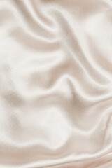 Beige silk fabric texture, Satin fashion Background for content.