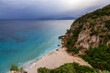 © edb3_16 - Sandy Beach on a rocky coast near Cala Gonone, Sardinia. Cloudy Sunrise Sky.