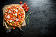 © Artem Shadrin - Fragrant pizza with tomatoes and rosemary.