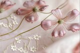 Fototapeta Kwiaty -  a close up of a pink flower on a white cloth with white flowers on it and a green stem on the side of the flower, and a white stem on the side of the. Generative AI