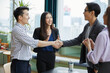 © offsuperphoto - businesspeople shaking hands and clapping hands for celebrating success at work in the office