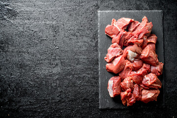 Sticker - Sliced raw beef on a stone Board.