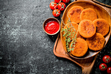 Sticker - Fish cutlets on a plate with thyme,tomatoes and sauce.