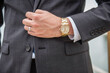 © Matea Michelangeli - A man holding his suit wearing a luxury watch