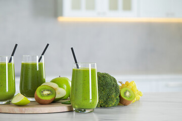 Wall Mural - Delicious fresh smoothie and ingredients on white marble table in kitchen. Space for text