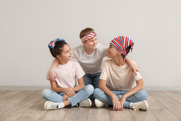 Poster - Happy little friends sitting near grey wall