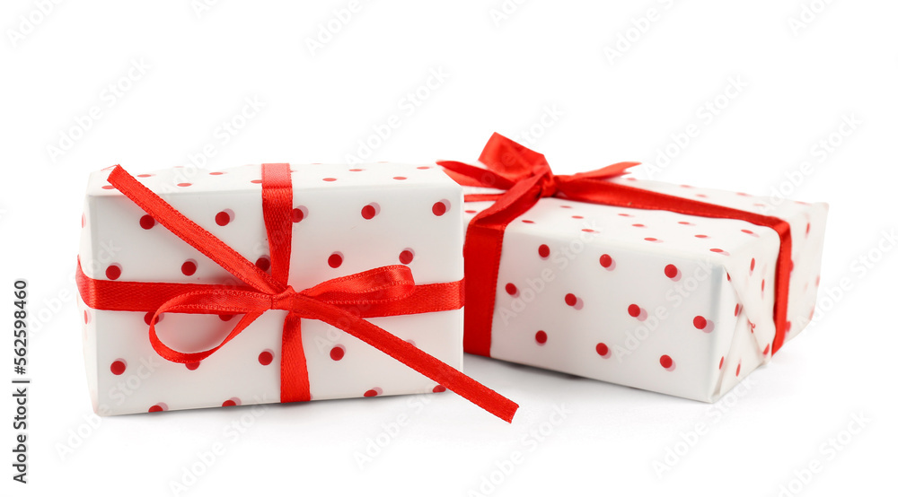 Gift boxes with red satin ribbon isolated on white background. Valentine's Day celebration