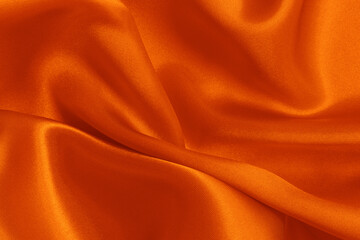 Wall Mural - Orange fabric cloth texture for background and design art work, beautiful crumpled pattern of silk or linen.