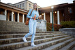 © K. A./peopleimages.com - Woman, student on campus stairs and university, education with learning and academic goals with scholarship outdoor. Books for reading, study and happy person with success, college life and studying