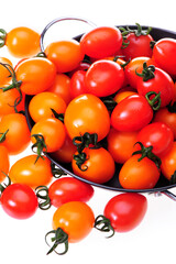 Wall Mural - red and yellow cherry tomatoes on white background .