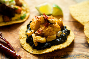 Tostada with hummus and vegetables. Tostada, name given to various dishes in Mexico that include a toasted tortilla as the main base of its preparation.