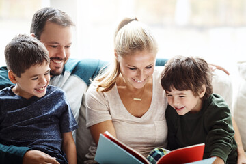 Wall Mural - Mom, dad and kids reading books on sofa for storytelling time with smile in happy family home. Love, learning and couple with children, book and fantasy story on couch, growth and child development.