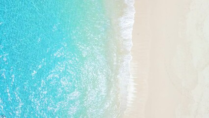 Wall Mural - Tropical beach with white sand, turquoise ocean water, aerial view. Top view of paradise beach in tropics with clear sea