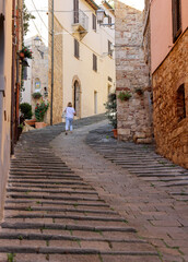 Wall Mural -  Steep and narrow street in old town of Massa Marittima, Italy