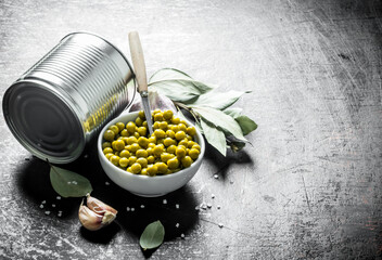 Poster - Canned green peas in a bowl with a tin can and Bay leaf.