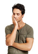 © peopleimages.com - A handsome young man looking pensive Isolated on a PNG background.