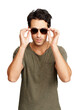 © peopleimages.com - A trendy young man putting on sunglasses Isolated on a PNG background.