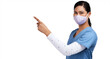 © peopleimages.com - Portrait of a young doctor wearing a surgical face mask and pointing to her right Isolated on a PNG background.