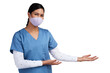 © peopleimages.com - Young doctor wearing a surgical face mask and gesturing to her left Isolated on a PNG background.