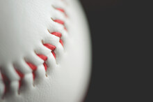 Macro Shot Of Baseball Ball Against Black Background