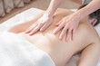 © Cavan Images - Woman receiving back massage at spa