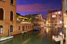 The City Of Venice At Night With A Lonely And A Little Canal