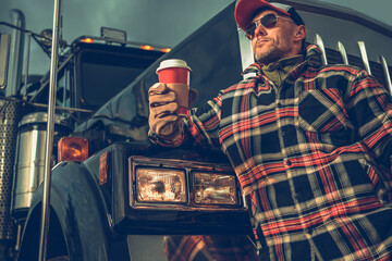 Wall Mural - American Semi Truck Driver Taking Short Coffee Break