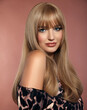 Beautiful healthy hair style. Beauty woman portrait. Attractive blonde model with makeup and shine straight hairstyle.